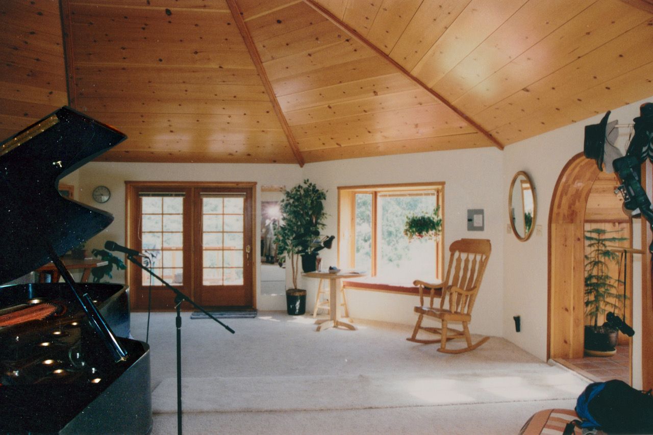 Inside the studio, with piano.