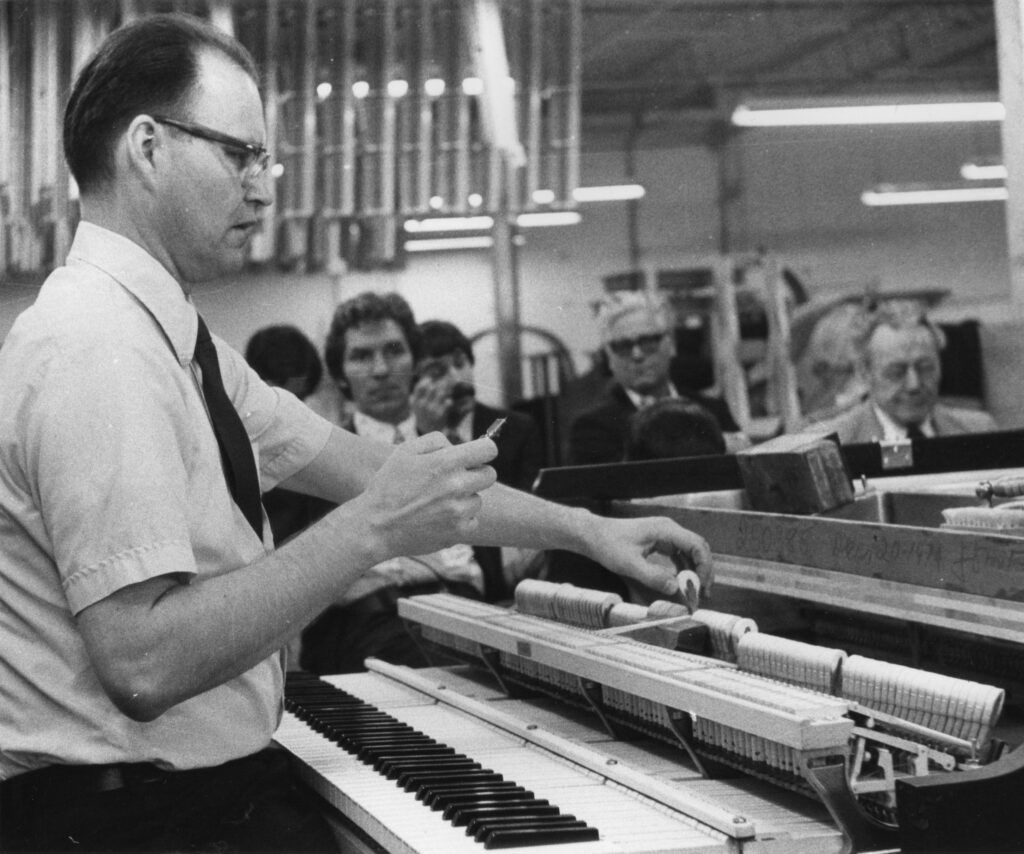 Verne working on a piano.