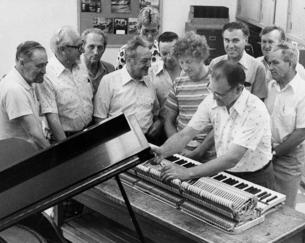 Verne working on a piano.